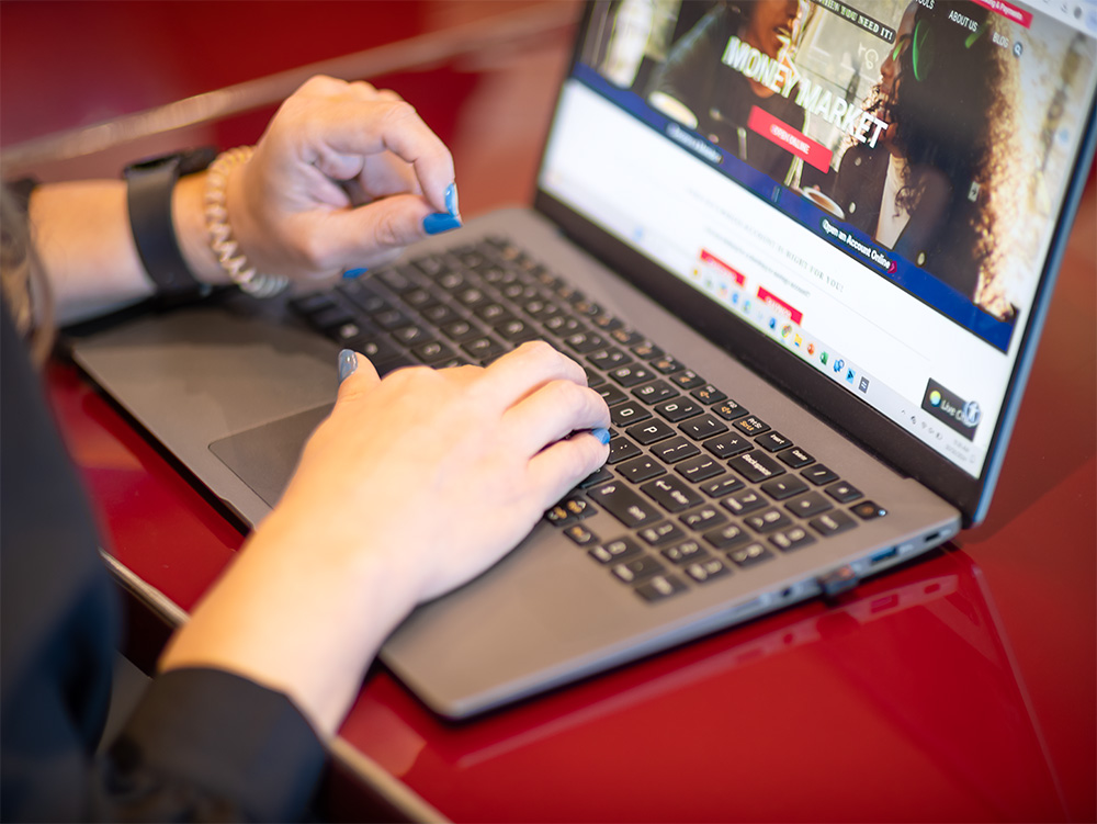 typing hands on a laptop